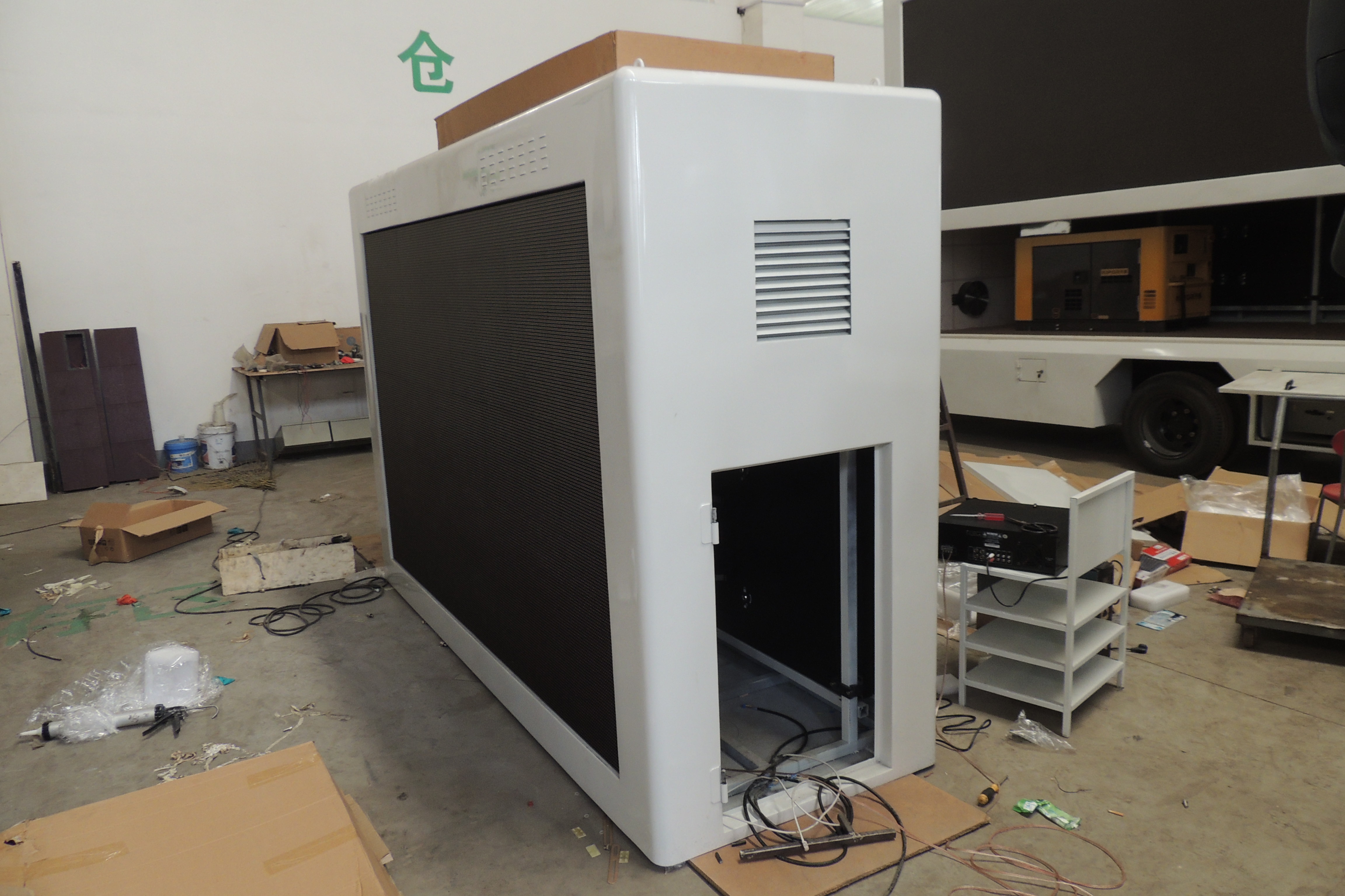 Installing LED light panels onto one of our mobile LED displays.